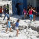 Residents play on top of ice after a heavy storm of rain and hail in Guadalajara